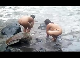 2992477 two indian mature womens bathing in river naked